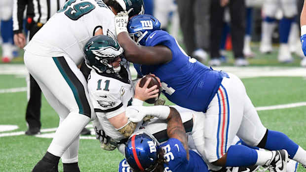 New York Giants defensive end Leonard Williams (99) and lineman Dalvin Tomlinson (94) sack Philadelphia Eagles quarterback Carson Wentz (11) in the second half. The Giants defeat the Eagles, 27-17, at MetLife Stadium on Sunday, Nov. 15, 2020.